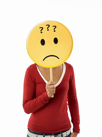 question funny - young adult woman holding emoticon with question marks on white background. Vertical shape, waist up Stock Photo - Budget Royalty-Free & Subscription, Code: 400-04233158