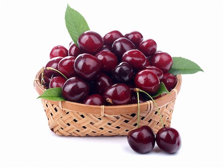 simsearch:400-04859130,k - Cherries in a basket isolated on white background. Photographie de stock - Aubaine LD & Abonnement, Code: 400-04233170