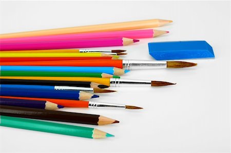 Pencils and paint brushes on a white background Fotografie stock - Microstock e Abbonamento, Codice: 400-04233379