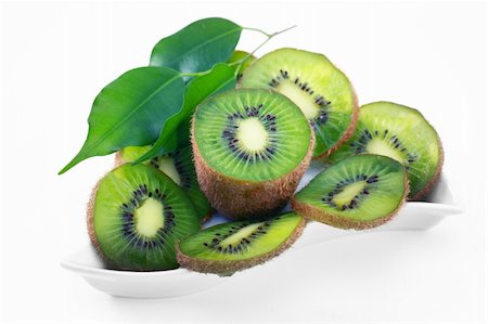 Kiwi with leaves on a white background Fotografie stock - Microstock e Abbonamento, Codice: 400-04233510