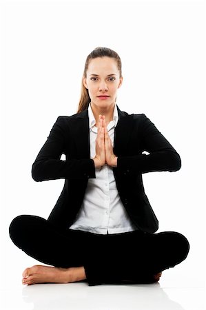 Young businesswoman doing yoga on white background studio Photographie de stock - Aubaine LD & Abonnement, Code: 400-04233732