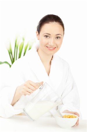 simsearch:400-08977333,k - Happy woman in bathrobe  for breakfast over white Stock Photo - Budget Royalty-Free & Subscription, Code: 400-04240002