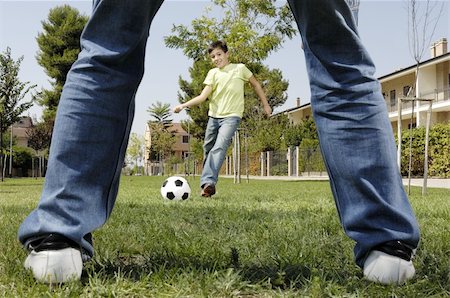 father and son playing football in urban park, concept of entertainment and education Stock Photo - Budget Royalty-Free & Subscription, Code: 400-04240904