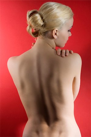 simsearch:400-06416497,k - fashion elegant shot of blond naked woman with hair styliss taking pose on red background Stock Photo - Budget Royalty-Free & Subscription, Code: 400-04240912