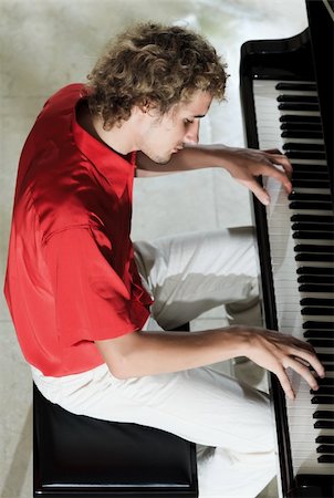 Handsome young man playing on the piano Stock Photo - Budget Royalty-Free & Subscription, Code: 400-04241256