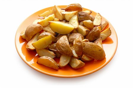 simsearch:400-04351737,k - Potatoes baked in their jackets on orange plate Stock Photo - Budget Royalty-Free & Subscription, Code: 400-04241508