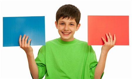 A boy is holding sheets of different color papper; isolated on the white background Stock Photo - Budget Royalty-Free & Subscription, Code: 400-04242079