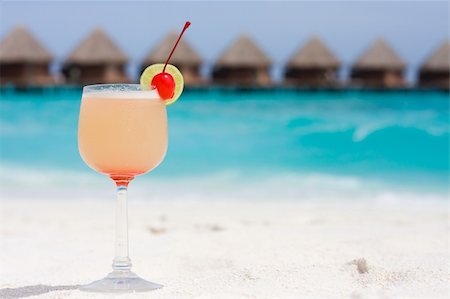 Cocktail on a beach with red cherry Stock Photo - Budget Royalty-Free & Subscription, Code: 400-04243050