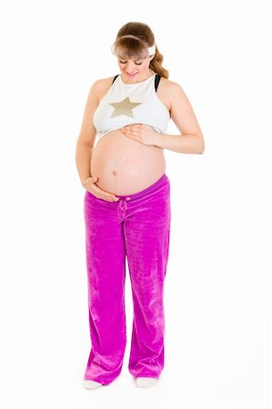 simsearch:400-05084530,k - Pregnant woman in sportswear holding her belly isolated on white Foto de stock - Super Valor sin royalties y Suscripción, Código: 400-04243244