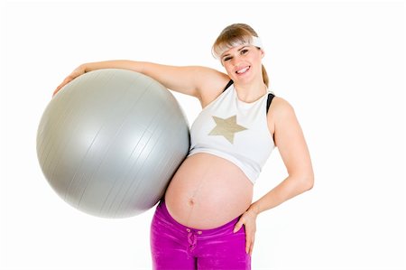 simsearch:400-04798379,k - Smiling beautiful pregnant woman  in sportswear holding fitness ball isolated on white Foto de stock - Super Valor sin royalties y Suscripción, Código: 400-04243248