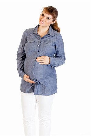 simsearch:400-04798379,k - Smiling beautiful pregnant woman holding her belly isolated on white background Foto de stock - Super Valor sin royalties y Suscripción, Código: 400-04243273