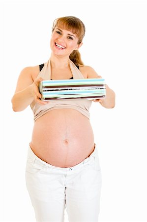 simsearch:400-04798379,k - Smiling pregnant woman holding present for her baby  isolated on white Foto de stock - Super Valor sin royalties y Suscripción, Código: 400-04243289