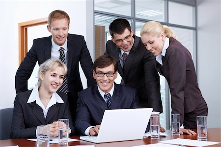 simsearch:400-05669026,k - Employees of the office looking at laptop monitor Stock Photo - Budget Royalty-Free & Subscription, Code: 400-04243368