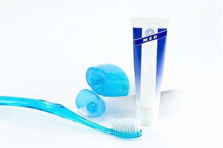 Tooth brush beside toothpaste on white background. Stock Photo - Budget Royalty-Free & Subscription, Code: 400-04243567