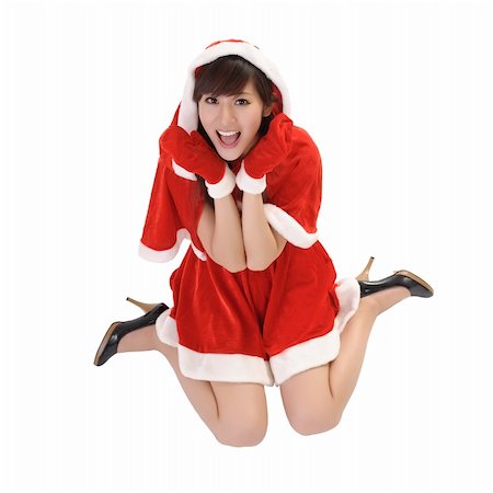 simsearch:400-04255437,k - Happy Christmas girl with smiling expression on face sit on studio white ground. Foto de stock - Super Valor sin royalties y Suscripción, Código: 400-04255103