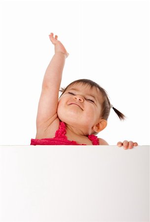 Cute beautiful happy baby infant girl holding white board while reaching up in the air with pride, isolated. Stock Photo - Budget Royalty-Free & Subscription, Code: 400-04255333