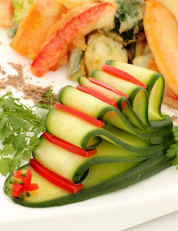 simsearch:400-04613511,k - Garnish of sliced cucumber with capsicum strips with tempura and fresh parsley. Fotografie stock - Microstock e Abbonamento, Codice: 400-04256036