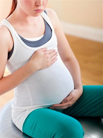 parent cheer sport - Close-up of a pregnant woman exercising on a ball in a fitness center Stock Photo - Budget Royalty-Free & Subscription, Code: 400-04256046