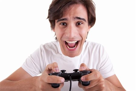 Handsome man, playing with gamepad, isolated on white background. Studio shot Stock Photo - Budget Royalty-Free & Subscription, Code: 400-04256255