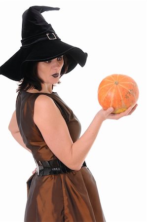 simsearch:400-08528806,k - Young witch with a pumpkin isolated on white background Photographie de stock - Aubaine LD & Abonnement, Code: 400-04256514