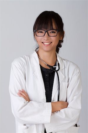 Attractive Chinese medical doctor with friendly smile. Stock Photo - Budget Royalty-Free & Subscription, Code: 400-04256911