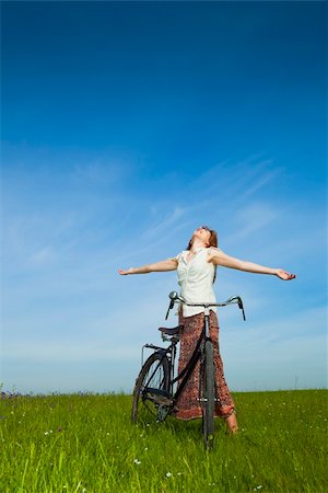 simsearch:400-04201795,k - Happy young woman with a vintage bicycle and relaxing Stock Photo - Budget Royalty-Free & Subscription, Code: 400-04256997