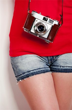 stylish woman snapshot - Girl with a vintage photographic camera Stock Photo - Budget Royalty-Free & Subscription, Code: 400-04257046
