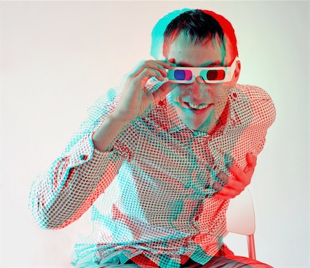 young man, looking through stereo glasses (anaglyph effect. need stereo glasses to view in 3D) Photographie de stock - Aubaine LD & Abonnement, Code: 400-04257515