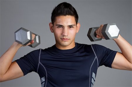 Hispanic fitness man lifting weights Stock Photo - Budget Royalty-Free & Subscription, Code: 400-04257786