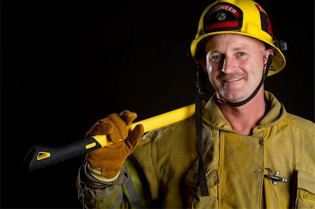 fireproof - Firefighter holding axe Stock Photo - Budget Royalty-Free & Subscription, Code: 400-04257947