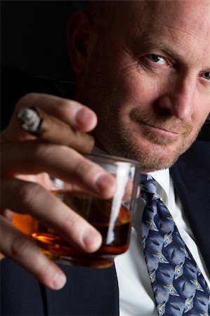 Businessman drinking and smoking cigar Photographie de stock - Aubaine LD & Abonnement, Code: 400-04257964