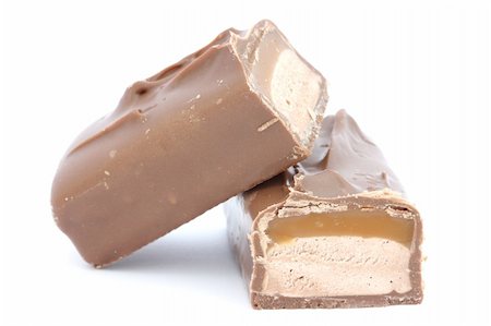 peanut object - Close up of caramel bar covered in chocolate with peanuts - cut in half Foto de stock - Super Valor sin royalties y Suscripción, Código: 400-04259339