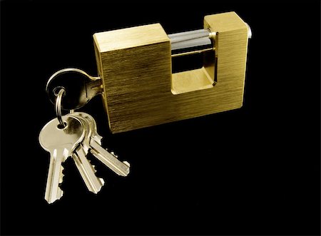 padlock is isolated on a black background Stock Photo - Budget Royalty-Free & Subscription, Code: 400-04259356