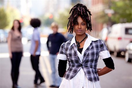 street models new york - A beautiful african american woman in a city setting with friends Stock Photo - Budget Royalty-Free & Subscription, Code: 400-04259556