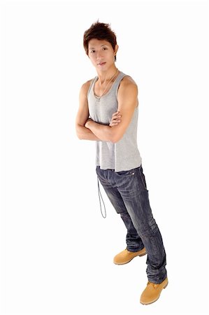 simsearch:400-04255435,k - Full length portrait of Asian young guy posing with friendly expression. Foto de stock - Super Valor sin royalties y Suscripción, Código: 400-04259604