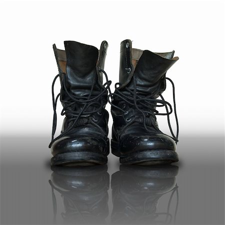 pair of old black combat on reflect floor Stock Photo - Budget Royalty-Free & Subscription, Code: 400-04259977