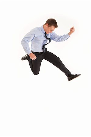 Smiling young businessman jumping in air with happiness Stock Photo - Budget Royalty-Free & Subscription, Code: 400-04264100