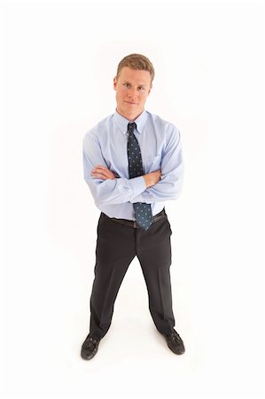 simsearch:400-07820348,k - Portrait of smiling young businessman standing  with arms crossed Photographie de stock - Aubaine LD & Abonnement, Code: 400-04264103