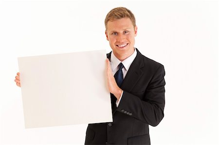 employee hold a sign - Head and shoulder portrait of businessman holding blank sign Stock Photo - Budget Royalty-Free & Subscription, Code: 400-04264128