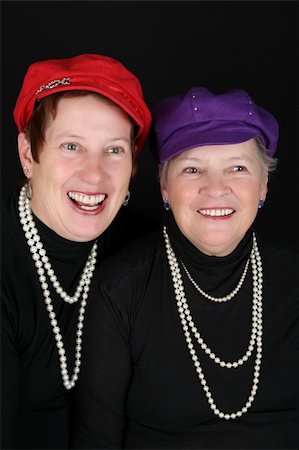 simsearch:400-04121486,k - Adult mother and daughter wearing red and purple hats Foto de stock - Super Valor sin royalties y Suscripción, Código: 400-04264496