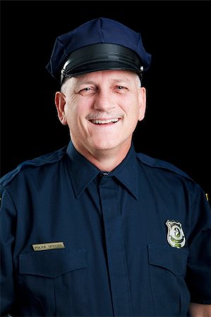 first responder - Portrait of friendly, smiling police officer on black background. Stock Photo - Budget Royalty-Free & Subscription, Code: 400-04264505