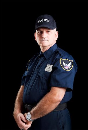 first responder - Serious portrait of a policeman on a black background. Stock Photo - Budget Royalty-Free & Subscription, Code: 400-04264519