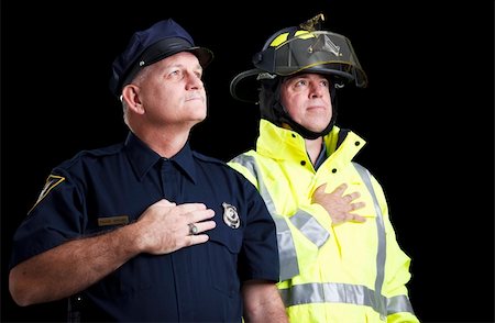 security salute photo - Police officer and fire fighter with their hands over their hearts as they say the Pledge of Allegiance. Stock Photo - Budget Royalty-Free & Subscription, Code: 400-04264510