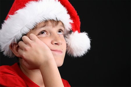 simsearch:400-05284316,k - Young boy wearing a red shirt and christmas hat Stockbilder - Microstock & Abonnement, Bildnummer: 400-04265196