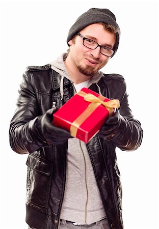 Warmly Dressed Handsome Young Man Handing Wrapped Gift Out Isolated on a White Background. Stock Photo - Budget Royalty-Free & Subscription, Code: 400-04265960
