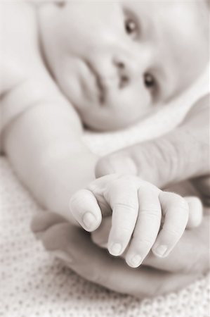 simsearch:400-04235194,k - Close up of father holding his child's hand. FOCUS on Baby Hand Stock Photo - Budget Royalty-Free & Subscription, Code: 400-04265997