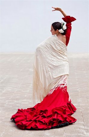 pictures of the traditional dance in spain - Woman traditional Spanish Flamenco dancer dancing outside in a red dress with a cream colored shawl Stock Photo - Budget Royalty-Free & Subscription, Code: 400-04266189