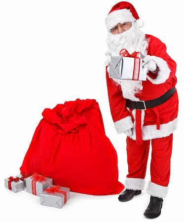 simsearch:400-05711909,k - Santa claus gives a present on white background Stock Photo - Budget Royalty-Free & Subscription, Code: 400-04266657