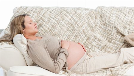 simsearch:400-04767824,k - Asleep pregnant woman lying on the sofa at home Foto de stock - Royalty-Free Super Valor e Assinatura, Número: 400-04266890