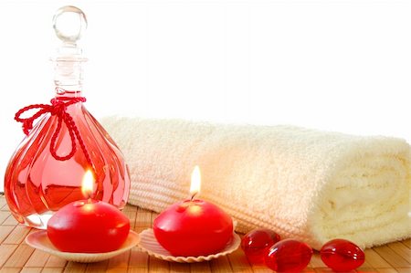 simsearch:400-05326817,k - red spa decoration with massage oil bottle and candles Stock Photo - Budget Royalty-Free & Subscription, Code: 400-04267147